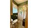 Bathroom featuring a shower with a floral shower curtain and olive-green paint at 10946 Maze Rd, Indianapolis, IN 46259
