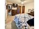 Bedroom with ceiling fan, mounted television, and view to adjoining room at 10946 Maze Rd, Indianapolis, IN 46259