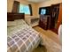 Bedroom featuring a bed, crib, and television with natural light from the window at 10946 Maze Rd, Indianapolis, IN 46259