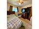 This neutral bedroom is filled with furniture, a bed, window, and closet at 10946 Maze Rd, Indianapolis, IN 46259