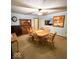 Cozy dining room features a wooden table set, a vintage hutch, and a decorative ceiling fan at 10946 Maze Rd, Indianapolis, IN 46259