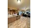 Open kitchen with stainless steel appliances, light countertops, and seamless flow to living spaces at 10946 Maze Rd, Indianapolis, IN 46259