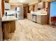 Spacious kitchen with modern stainless steel appliances, countertops and warm-toned cabinetry at 10946 Maze Rd, Indianapolis, IN 46259