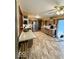 Well-equipped kitchen featuring stainless steel appliances, tile floors, and access to backyard at 10946 Maze Rd, Indianapolis, IN 46259