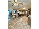 Modern kitchen with stainless steel appliances, neutral cabinets, and adjacent dining area at 10946 Maze Rd, Indianapolis, IN 46259
