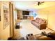 Cozy living room with comfortable seating, fireplace, media console and large television at 10946 Maze Rd, Indianapolis, IN 46259