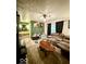 Green living room featuring a ceiling fan, sofa, and decorative rug at 10946 Maze Rd, Indianapolis, IN 46259