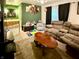 Inviting living room with comfortable seating, playful decor, and access to a bathroom at 10946 Maze Rd, Indianapolis, IN 46259