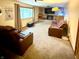 Comfortable living room with cozy seating, media console and large television at 10946 Maze Rd, Indianapolis, IN 46259