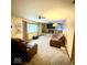 Relaxing Gathering area includes a large flat-screen TV, fireplace, and leather couch seating at 10946 Maze Rd, Indianapolis, IN 46259