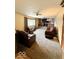 Cozy living area with plush seating, neutral carpet, and stylish decor features at 10946 Maze Rd, Indianapolis, IN 46259