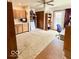 Home office with built in cabinets, work space, and door to backyard at 10946 Maze Rd, Indianapolis, IN 46259