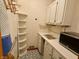 Pantry offering ample storage space with white cabinetry and a corner shelf at 10946 Maze Rd, Indianapolis, IN 46259