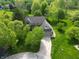 Aerial view of the property highlighting the home, mature trees, and surrounding landscape at 11021 Brentwood Ave, Zionsville, IN 46077