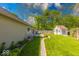 Scenic backyard view with lush greenery, a charming shed, and a well-manicured lawn at 1120 Crystal Ct, Avon, IN 46123