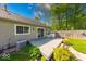 Spacious backyard deck with a seating area, surrounded by beautiful landscaping and a well-maintained lawn at 1120 Crystal Ct, Avon, IN 46123