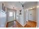 Welcoming foyer featuring hardwood floors, a decorative front door, and neutral wall colors at 1120 Crystal Ct, Avon, IN 46123