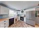 Well-lit kitchen features butcher block counters and a stainless steel refrigerator at 1120 Crystal Ct, Avon, IN 46123