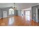 Spacious living area with hardwood floors, sliding glass doors, and ample natural light at 1120 Crystal Ct, Avon, IN 46123
