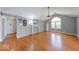 Bright living room featuring hardwood floors, neutral paint, and a fireplace for a cozy atmosphere at 1120 Crystal Ct, Avon, IN 46123