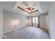 Bright main bedroom with neutral colors, carpet, and floor lamps at 1120 Crystal Ct, Avon, IN 46123