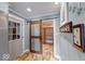 A spacious pantry featuring a sliding barn door, cottage grocery sign, and ample shelving at 1120 Crystal Ct, Avon, IN 46123