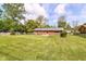 Brick home with a large backyard, perfect for outdoor activities and relaxation at 11603 Peacock Dr, Indianapolis, IN 46236