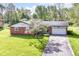 Charming brick ranch home with well-maintained lawn and attached two-car garage at 11603 Peacock Dr, Indianapolis, IN 46236
