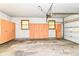 Spacious garage with ample storage cabinets and a clean, functional space at 11603 Peacock Dr, Indianapolis, IN 46236