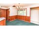 Eat-in kitchen with charming wood paneling and bright natural light at 11603 Peacock Dr, Indianapolis, IN 46236