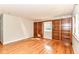 Spacious living room with hardwood floors and built-in shelving at 11603 Peacock Dr, Indianapolis, IN 46236