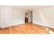 Open living room featuring gleaming hardwood floors and neutral wall colors at 11603 Peacock Dr, Indianapolis, IN 46236