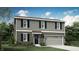 Charming two-story home with neutral siding, black shutters, landscaped yard, and attached two car garage at 11820 Vale St, Indianapolis, IN 46235