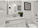 Contemporary bathroom featuring modern fixtures, white cabinetry, and framed artwork on the wall at 11840 Vale St, Indianapolis, IN 46235