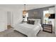 Cozy bedroom with a comfortable bed, decorative wall art, and a view into an adjoining bathroom at 11840 Vale St, Indianapolis, IN 46235