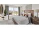 Bright bedroom with a neutral palette, large windows, and modern decor at 11840 Vale St, Indianapolis, IN 46235