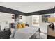 Charming bedroom with sports-themed decor, including football accents and playful wall art at 11840 Vale St, Indianapolis, IN 46235