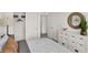 Light and airy bedroom with closet space, light-colored walls, and a decorative mirror at 11840 Vale St, Indianapolis, IN 46235