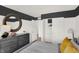 Well-lit bedroom with sports themed decor, a dresser, and a peek at the closet area at 11840 Vale St, Indianapolis, IN 46235