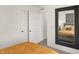 A bedroom with a large mirror on the wall, multiple doors, and stylish design at 11840 Vale St, Indianapolis, IN 46235