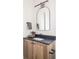 Bathroom with a dark countertop and wood vanity offering ample storage at 11904 Spring Mill Rd, Carmel, IN 46032