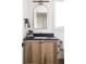 Bathroom with a dark countertop and wood vanity offering ample storage at 11904 Spring Mill Rd, Carmel, IN 46032