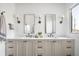 Bathroom boasts double sinks, quartz countertops, updated lighting, and modern hardware at 11904 Spring Mill Rd, Carmel, IN 46032