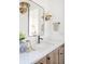 Bathroom featuring a bright vanity with modern fixtures and decor at 11904 Spring Mill Rd, Carmel, IN 46032