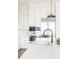 Modern kitchen featuring stainless steel appliances and a sleek black faucet at 11904 Spring Mill Rd, Carmel, IN 46032