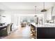 Bright kitchen with a large island, marble countertops, and an open concept layout at 11904 Spring Mill Rd, Carmel, IN 46032