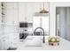 Elegant kitchen featuring stainless steel appliances and stylish pendant lighting at 11904 Spring Mill Rd, Carmel, IN 46032
