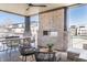 Outdoor patio featuring a brick fireplace, dining table, and comfortable seating area at 11904 Spring Mill Rd, Carmel, IN 46032