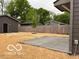 Spacious backyard featuring a concrete patio and wooden privacy fence at 1215 Herbert St, Indianapolis, IN 46202