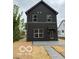 Modern two-story home with gray siding, complemented by clean lines and a welcoming entrance at 1215 Herbert St, Indianapolis, IN 46202
